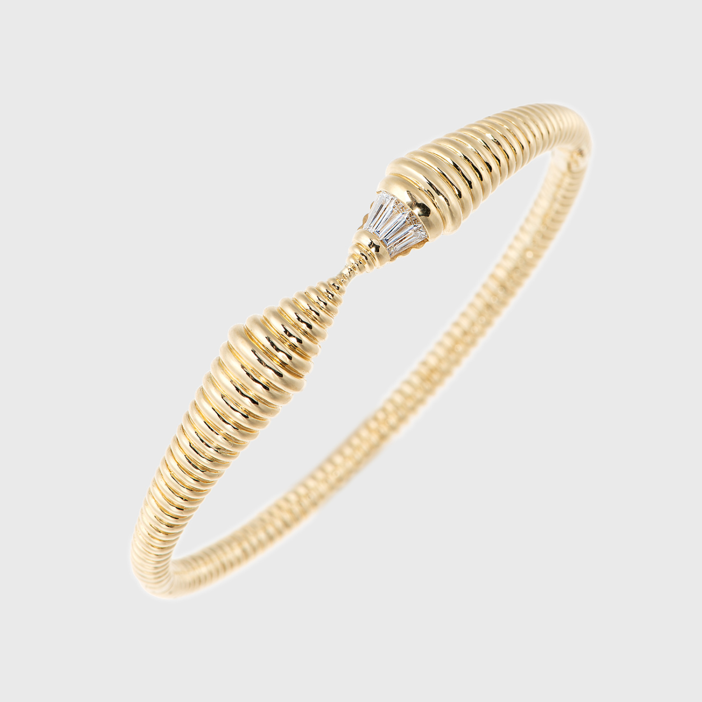 Yellow gold bracelet with tapered baguette cut white diamonds