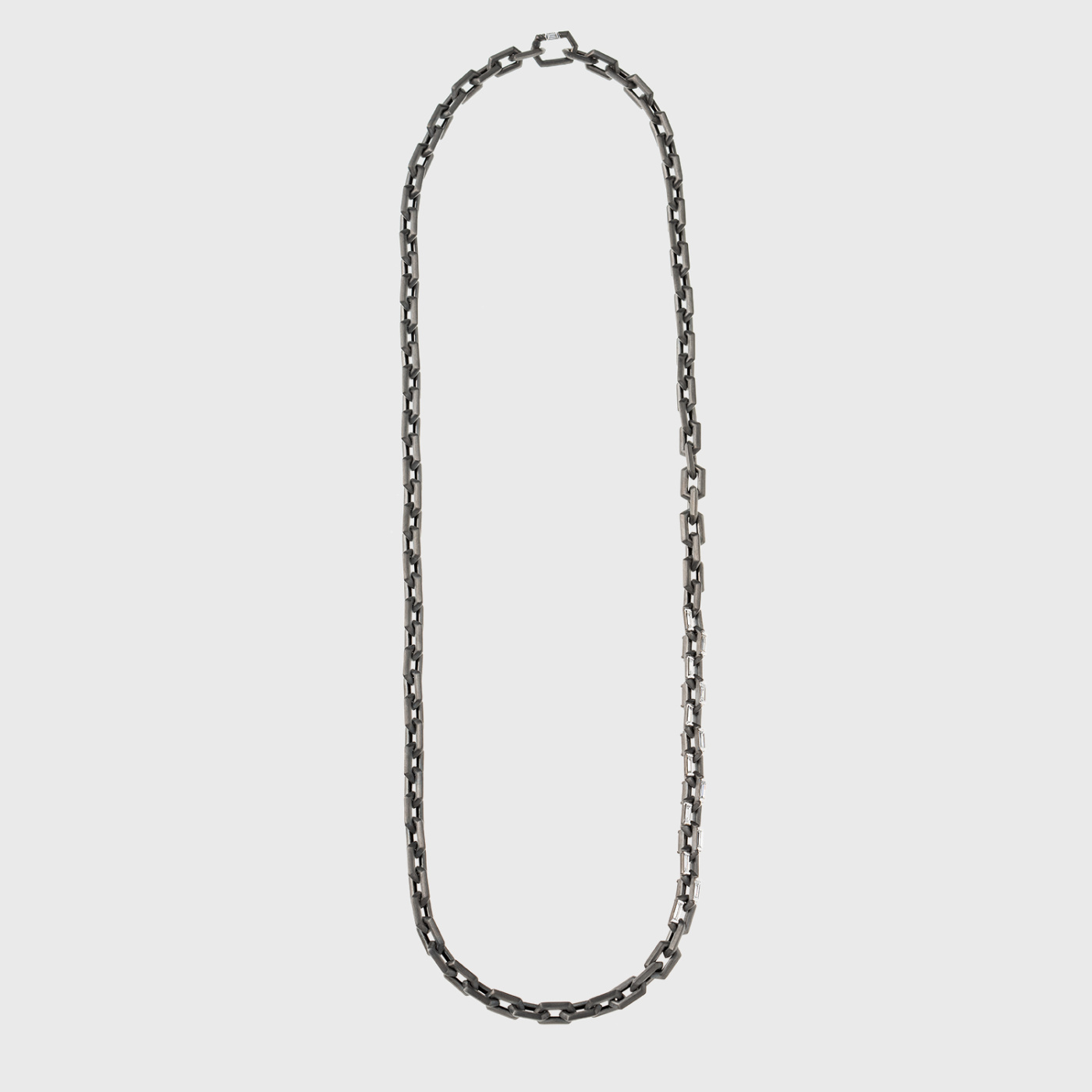 Black gold chain link necklace with baguette cut white diamonds