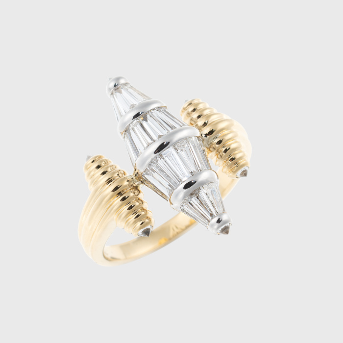 White & yellow gold ring with tapered baguette cut white diamonds