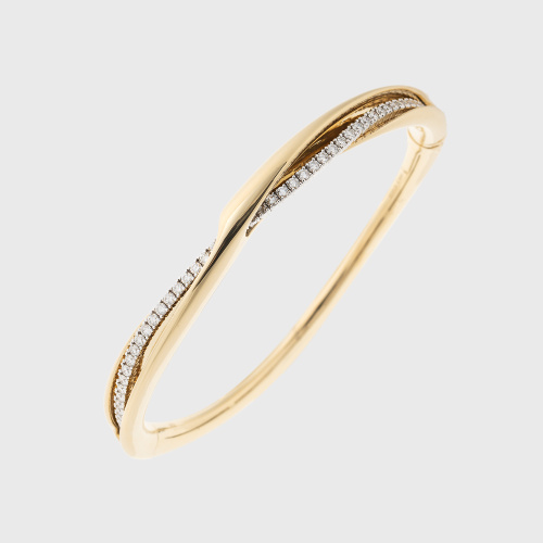 Yellow gold cuff bracelet with baguette cut white diamonds